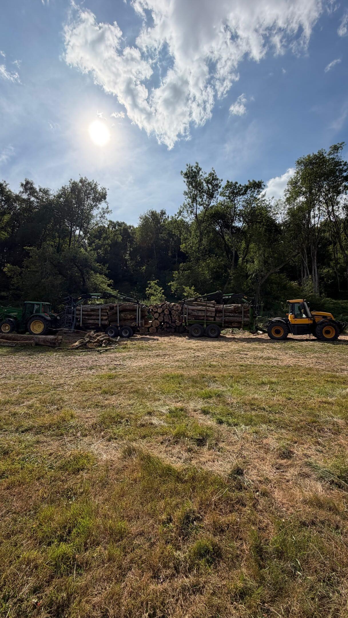 Tractor and trailer removing arisings from a site being cleared